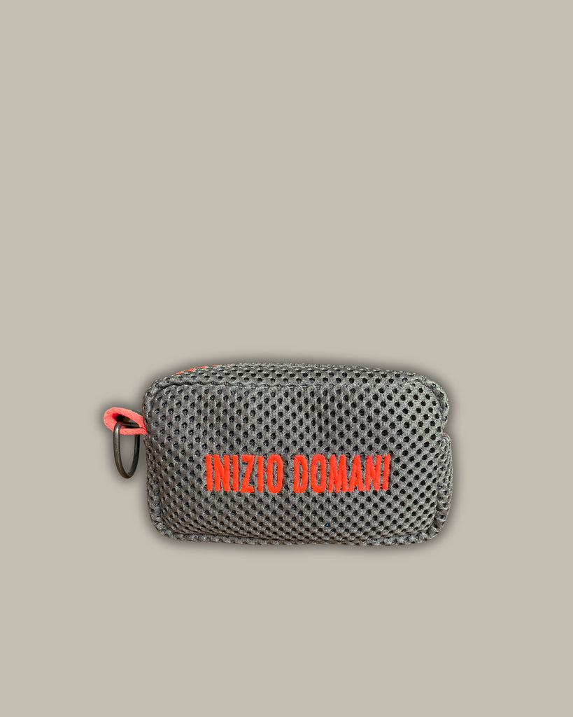 Light blue pill with fluorescent pink embroidery