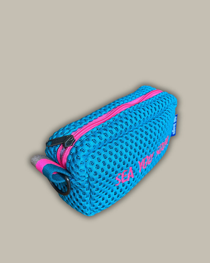 PILLOLA neoprene turchese + ricamo fucsia