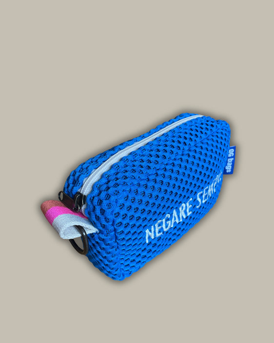 Light blue pill with fluorescent pink embroidery