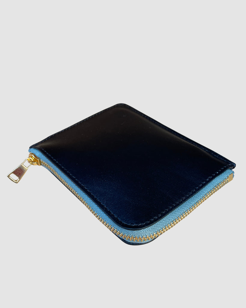 IL BAU pelle nero + zip verde acqua