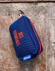 Light blue pill with fluorescent pink embroidery