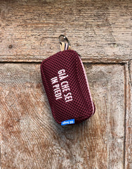 Light blue pill with fluorescent pink embroidery