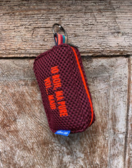 PILLOLA neoprene bordeaux + ricamo arancione fluo